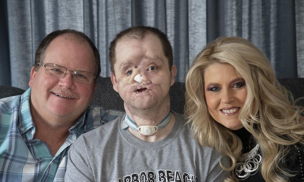 Derek Pfaff, with his parents Jerry and Lisa
