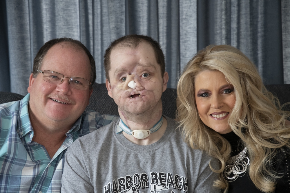 Derek Pfaff, with his parents Jerry and Lisa